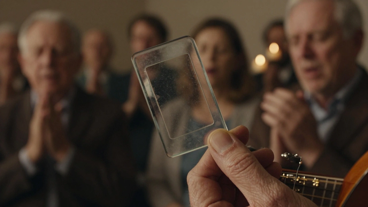 Close-up of a glass slide hovering mid-glissando on a guitar string, with a congregation singing in warm candlelight.